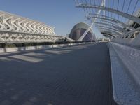 the buildings that line the walkway are designed like a wave and curves in front of them