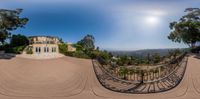 a panoramic view of the mansion overlooking the town of santa rosa and hills