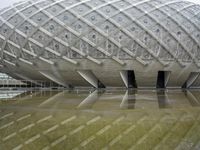 a very nice looking structure in water with no people standing in it with umbrellas