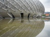 a very nice looking structure in water with no people standing in it with umbrellas