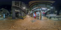 360 - view picture of a city street at night, taken from above a glass storefront