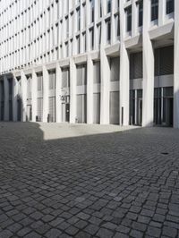 a building with three doors on one wall and a red fire hydrant on the other side