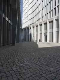 a building with three doors on one wall and a red fire hydrant on the other side