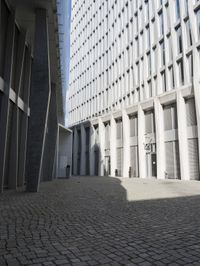 a building with three doors on one wall and a red fire hydrant on the other side