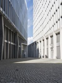 a building with three doors on one wall and a red fire hydrant on the other side