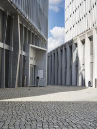 a building with three doors on one wall and a red fire hydrant on the other side