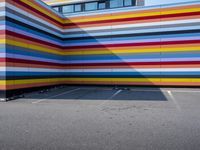 a colorful building painted to look like it's painted in stripes and colors of different colors