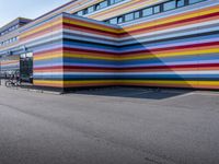 a colorful building painted to look like it's painted in stripes and colors of different colors