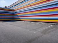 a colorful building painted to look like it's painted in stripes and colors of different colors