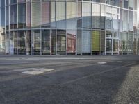 a person walking by a building on the street with no traffic or people visible in the photo