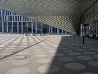 a big building with a geometric design on the side of it that has white circles