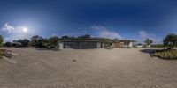 this is a photograph taken of a big house on the beach, taken from a fisheye lens