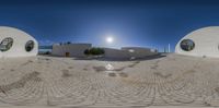 a panorama photo taken of the front entrance of a house on the beach with large circle windows and round mirrors in the windows