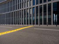 empty street with buildings next to it on the side of a building that has a bus in the middle