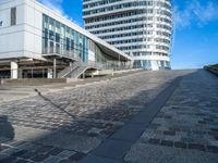 a building that's been designed to be connected with two roads with some stairs