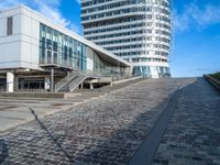 a building that's been designed to be connected with two roads with some stairs