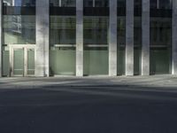 a fire hydrant in front of an empty building with a door to the outside