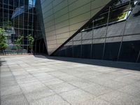 the view of the exterior of a modern looking building in daylight time with reflection of its windows