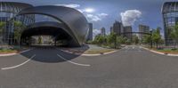 this is a circular view of a modern building in a city street and looking like it's out of a tunnel