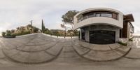 an 360 - angle picture shows a modern building in an urban setting with a very circular facade