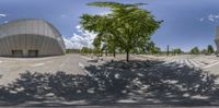 this is a 360 - image of the building with its doors open and trees in front