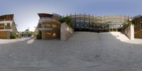 multiple angles showing a circular home on the beach, including steps and stairs and a front door