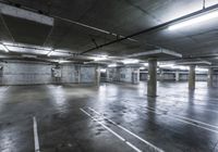 there is a empty parking garage with no people in it at night or day time