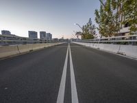 there is a white line going along the side of the road and in front of some buildings