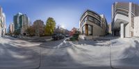 the reflection is of the street in the 360 - shot fisheye lens on the sidewalk