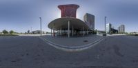 the view from inside of a fisheye lens of a cityscape, with tall building and sky scrapers