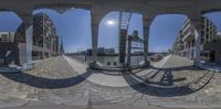 there is a large fisheye lens on the city street, showing all three colors of the same pattern