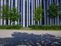 two people are running with their luggage outside a building in a city in france - stock image