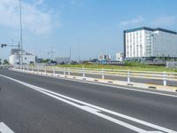 the highway that has two lines in it that is white on both sides, with cars driving on both sides