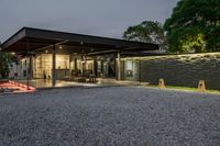 the entrance to this modern house at night is lit up by leds on the walls