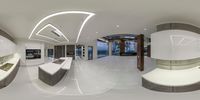 a full view of a modern kitchen with large windows in the ceiling and white marble counters