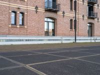 a man is riding a skateboard in the street near some buildings, as if he is going for an urban road