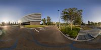 a 360 - lens view of an office building and the intersection of a bike lane