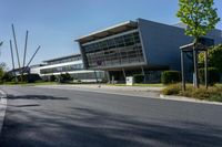 an empty street and an office building in the distance on a clear day in europe