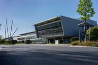 an empty street and an office building in the distance on a clear day in europe