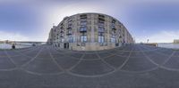 the street outside of a building is shown in this view of its reflection in another lens