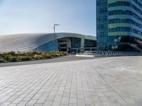 empty area in front of a modern office building, outside of the city center,