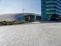 empty area in front of a modern office building, outside of the city center,