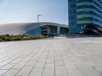 empty area in front of a modern office building, outside of the city center,