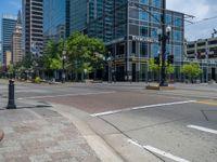 an intersection with buildings on both sides and a street light in the middle of the road