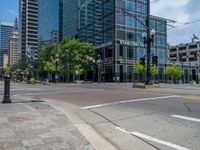 an intersection with buildings on both sides and a street light in the middle of the road