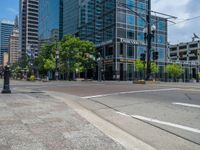 an intersection with buildings on both sides and a street light in the middle of the road