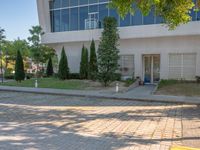 a very nice large modern office building with nice landscaping and landscaping services on it's sides