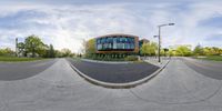 a fish eye view of an office building on a street corner in a residential neighborhood