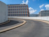 a car is driving on the highway through an underground parking garage area in a city