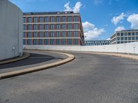 a car is driving on the highway through an underground parking garage area in a city